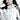 杏色撥水防風外套 <20221670-12>，高領、拉鍊，體現日系戶外風格的女性，微微低頭側視。.