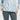 一個人穿著粉藍色超薄防風外套 <20121817-111> 搭配白底灰色緊身褲。這款外套非常適合夏日戶外休閒服，結合時尚與舒適。只有軀幹和上肢可見。.