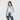 一位女士身穿粉藍色超薄防風外套 <20121817-111>，外搭白色crop top和灰色leggings，站在白色背景下，自信地微笑著--夏日戶外休閒服的時尚選擇。.