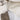 A close-up of the 杏色撥水防風外套 <20221670-12> featuring beige and tan color block design, visible inner lining, and a partially open collar zipper-ideal for 日系戶外風格和戶外活動。.