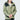 A person wears an 杏色2合1撥水防風外套 <20621678-12> with a white shirt against a plain light background, hands loosely clasped, face partially out of frame, 展現都會休閒風格。.