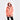 Person wearing a peach-colored raincoat on a white background