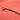 Close-up of a coral-colored jacket with a black zipper