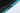 Close-up of a zipper on a black and teal jacket with a white background