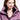Woman wearing a purple jacket with 'Wonda' branding on a white background