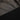 Dark fabric with geometric pattern on a black background