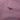 Close-up of a purple fabric with 'Wonda' logo embroidered on it.