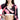 一位女士穿著紅色 3 件套裝運動泳衣 <21221558>，以紅、黑、白三色為主色調，搭配運動感十足的剪裁上衣與套頭衫。她微微笑著，手放在臀部，臉部部分可見。.