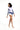 一位捲髮女性穿著粉紫色 3 件套裝運動泳衣 <21221648>，以撞色運動上衣和搭配短褲為特色，赤腳站立在白色背景中，非常適合沙灘活動。.