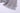 灰色連身裙連身背心泳衣 <22231632> 的特寫，淺灰色的薄紗搭配兩條波浪狀、層次分明的下擺和淺藍色縫線，在白色背景的映襯下，展現出輕鬆優雅的泳裝造型。.