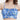一位女士穿著彩藍色荷葉邊 MIX&MATCH 泳衣上身 <23541693>--一件藍色縐褶上衣，荷葉邊細節與活潑的熱帶印花，非常適合夏天的水上活動。.