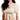 女子身著杏色日本製泳衣 <423009-IV>，米色圓領上衣式泳衣，短袖蓬蓬鬆鬆，上衣褶皺，前腰系帶。白色背景，她的臉部分在畫面之外。.