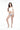 在白色背景上，一位女士穿著白色一字肩日本製泳衣 <450301-WT>--白色露肩泳衣搭配藍色花朵比基尼底褲。她赤腳站著，輕鬆地看著鏡頭，一隻手摸著頭髮。.