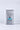 長方形銀色防火袋 <72101935-NG01>，以「SAFE POUCH」字樣為特色，配以藍色火焰圖案，由耐燃纖維製作而成，行動電源收納，直立於純白背景上。.